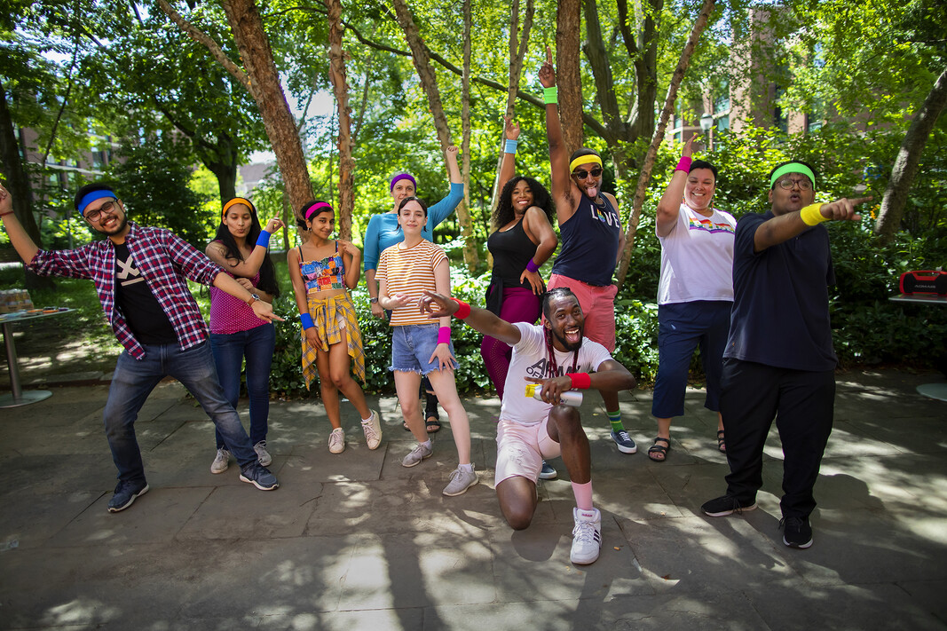 Choreographer Devon Sinclair and members of Penn’s LGBTQ+ community take a break from dancing in the courtyard at the LGBT Center during “Dance Outside w/Pride.” 